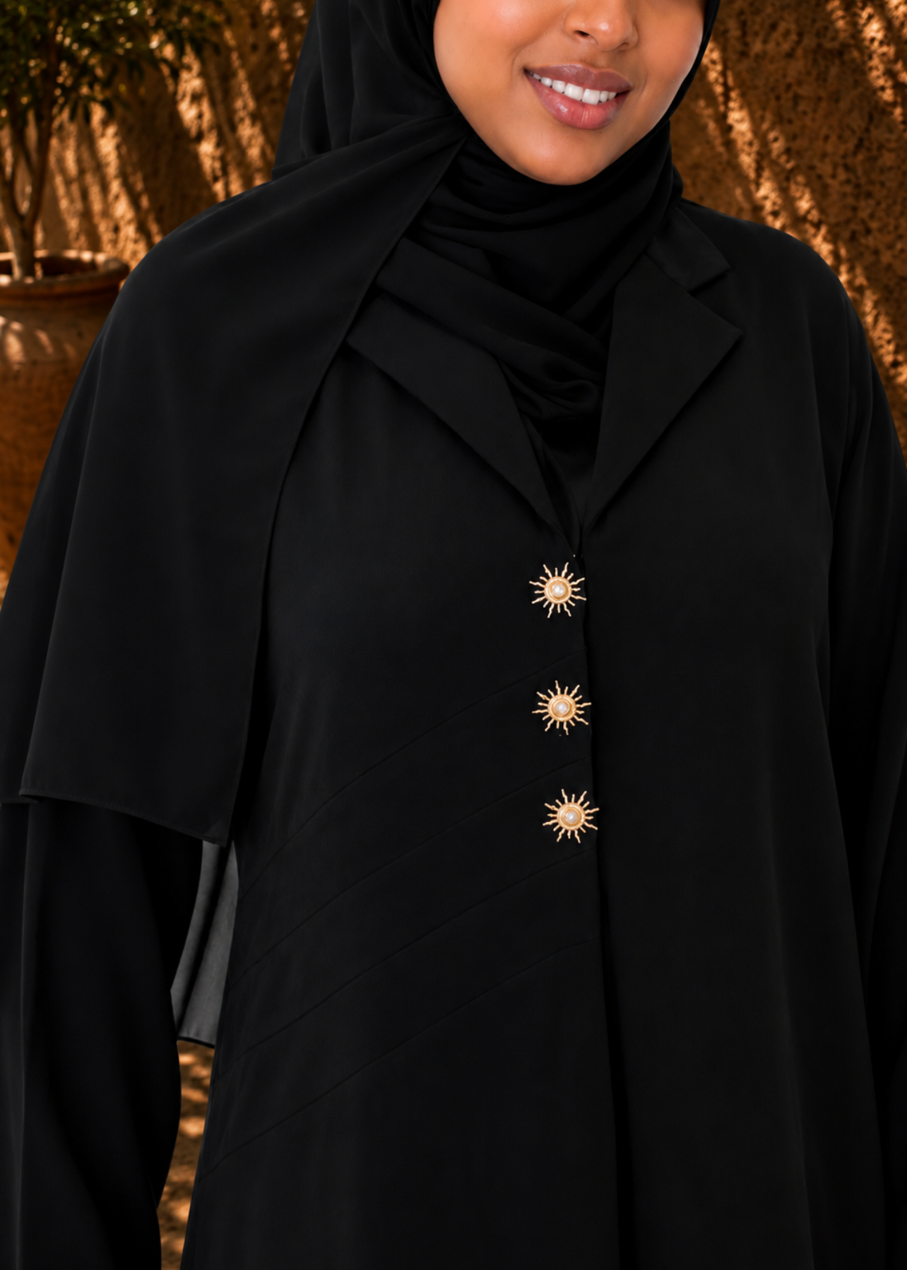 The Noir Soleil Abaya - gold button detail